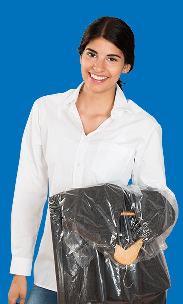 An Appearance Plus customer carrying freshly cleaned garments